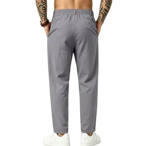 Vista posterior de pantalones casuales de lino gris para hombre con cintura elástica