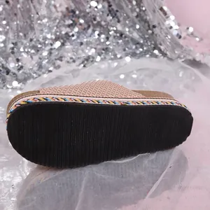 Detailed view of the textured anti-slip thick sole of a fashion rhinestone platform slide sandal