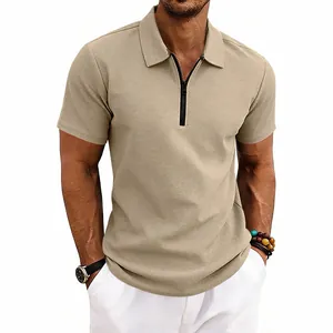 Close-up showing the textured waffle knit fabric of this beige men's polo shirt.