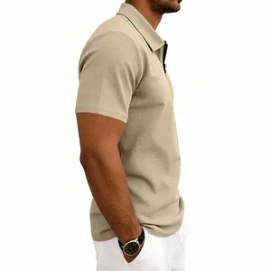 Detailed macro view of khaki waffle knit texture on men's short sleeve zip-up polo shirt