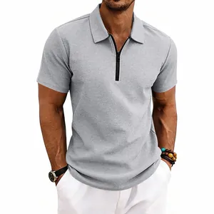 Detailed macro view of grey waffle knit fabric on men's short sleeve polo shirt