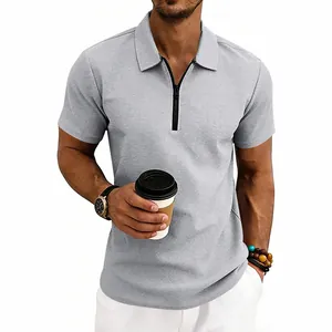 Detail of men's grey waffle knit polo shirt with stylish zipper collar.