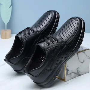 Breathable men's black perforated leather business casual dress shoes for summer wear.