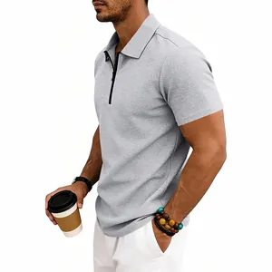 Detailed side profile of a men's grey waffle-knit short sleeve polo shirt with zipper