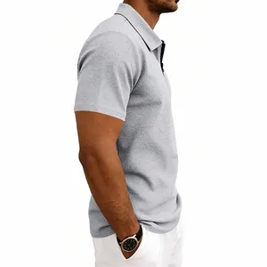 Side view of a men's light grey waffle knit polo shirt with quarter-zip collar.