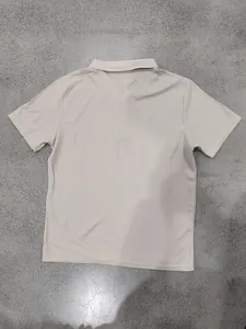 Back view of men's beige waffle-knit polo shirt with short sleeves and lapel collar