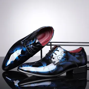 Close-up of glossy blue floral pattern on men's business oxfords with a mirror finish.