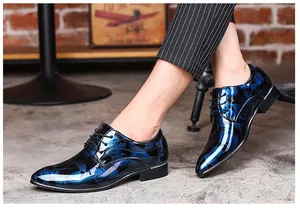 Detailed view of men's blue floral patent leather dress shoes for business attire