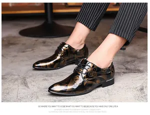 Detailed view of men's business oxfords featuring a bronze mirror finish and floral patterns.