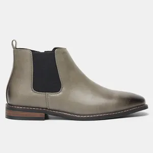 Vue détaillée latérale de bottines Chelsea classiques pour hommes en cuir taupe élastique