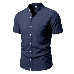 Close-up detail of navy blue linen men's shirt featuring stand collar and chest pocket