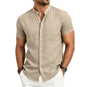 Close-up detail of a men's khaki linen short-sleeve shirt with a stand collar.