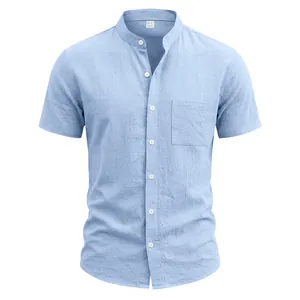 Detail of light blue linen-blend short sleeve shirt with mandarin collar and chest pocket