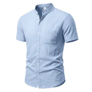 Detail of a light blue men's linen short sleeve shirt with a minimalist stand collar design.