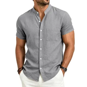 Detailed macro shot of grey linen short-sleeve shirt with stand collar and pocket