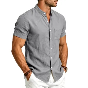 Detailed view of grey linen short-sleeve shirt with band collar and chest pocket