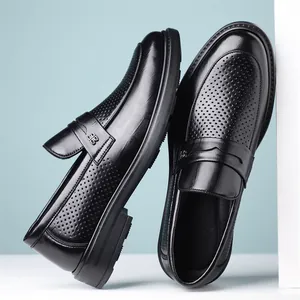 Elegant black men's business loafers featuring a breathable hollow design for summer wear