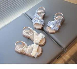 Detailed view of fairy style girls princess sandals with elegant mesh bows and pearls.