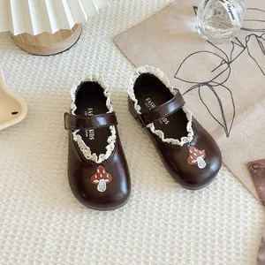 Brown children's Mary Jane shoes with mushroom embroidery and delicate lace trim