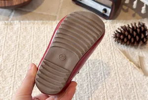 Detailed close-up of soft brown non-slip rubber sole for girls Mary Jane shoes