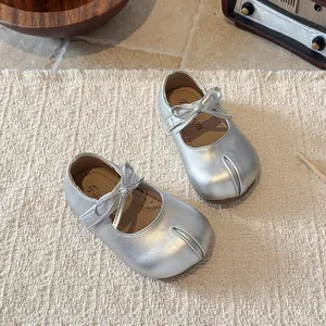 Elegant silver girl's Mary Jane shoes with bow tie and soft sole in British style.