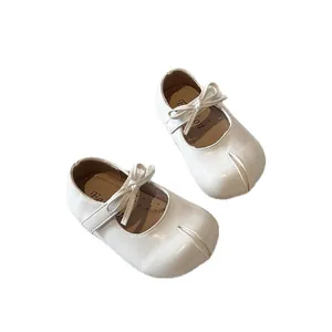 Elegant white girls Mary Jane princess shoes with lovely bow and comfortable soft sole