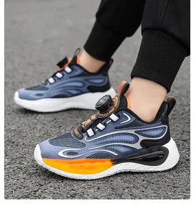 Detailed view of boys sports sneakers with a rotary buckle system on asphalt background