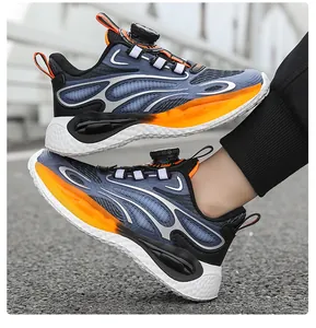 Detailed view of boys basketball sneakers with rotary buckle and orange flame patterns