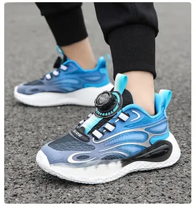 Blue kids sneakers with rotary buckle system shown on model during outdoor play.