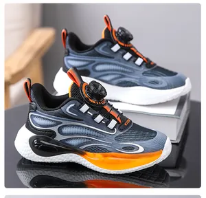 Detailed view of children's basketball shoes with convenient rotary buckle system.