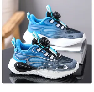 Detail view of blue and black boys sports shoes featuring a convenient rotating buckle design.