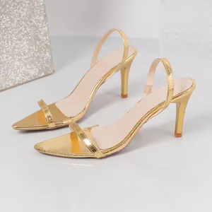 Elegant gold pointed-toe high heel sandals with minimalist strap design and slingback.
