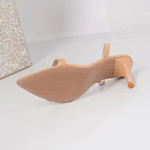Detailed close-up view showing the anti-slip rubber sole and stiletto heel of a nude sandal