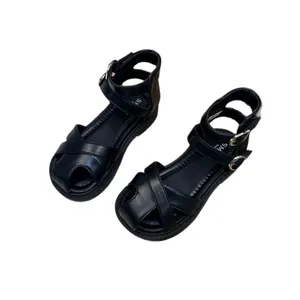 Elegant black closed-toe summer sandals for young girls featuring a soft sole and straps