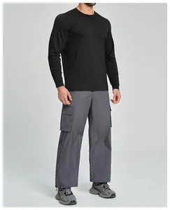 Men's black Lyocell Merino wool long-sleeve athletic top for outdoor fitness activities