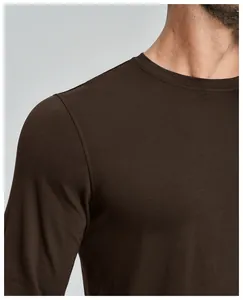 Detail view of men's chocolate brown merino wool blend shirt neckline and shoulder seam