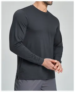 Detailed close-up view of men's dark grey long-sleeve athletic shirt fabric texture