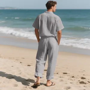 Rear view of comfortable men's grey linen beach set featuring short sleeve shirt and long pants