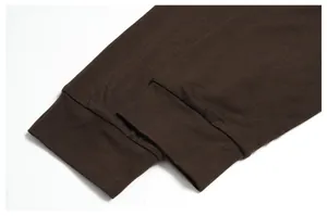 Close-up of ribbed cuffs on a brown merino wool blend long-sleeve shirt for men.