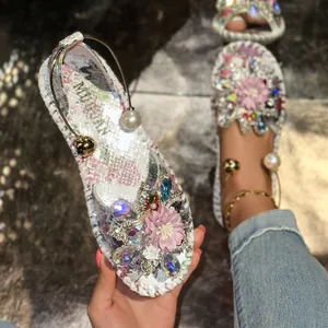 Elegant flat sandals featuring floral print, pearl beads and crystal flower decoration