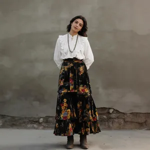 Elegant high-waisted floral velvet tiered cake skirt shown on a model in vintage style