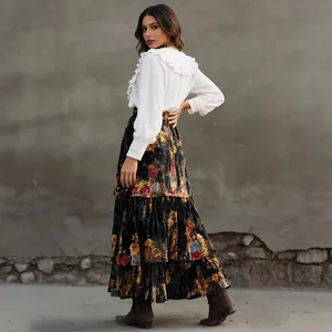 Model wearing vintage floral tiered high waist long skirt with elegant ruffle blouse.