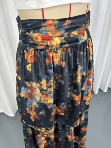 Detailed close-up view of a vintage floral tiered maxi skirt with an elegant high waist design.