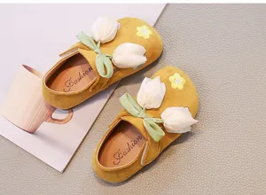 Yellow girl's tulip loafers with flower decorations and ribbon bows