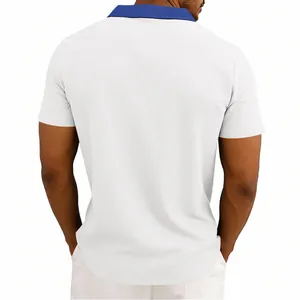 Detailed back view of men's waffle-knit polo shirt in white with blue collar detail.