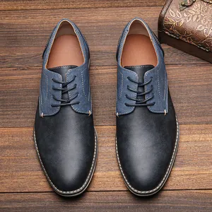 Detailed top view of men's casual Derby shoes with blue denim panel on wood background