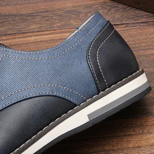 Close-up detail of blue mesh and black leather men's casual shoe with stitching