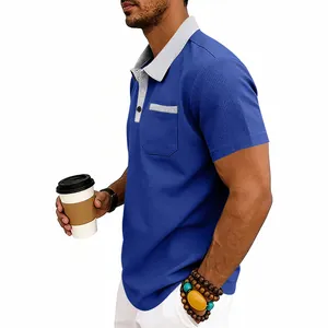 Detail view of men's blue waffle knit polo shirt featuring a grey contrast pocket trim