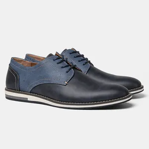 Detailed side view of navy blue two-tone men's casual leather shoes with breathable design.