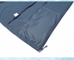 Close-up of the interior mesh pocket and zipper on a blue sun protection jacket